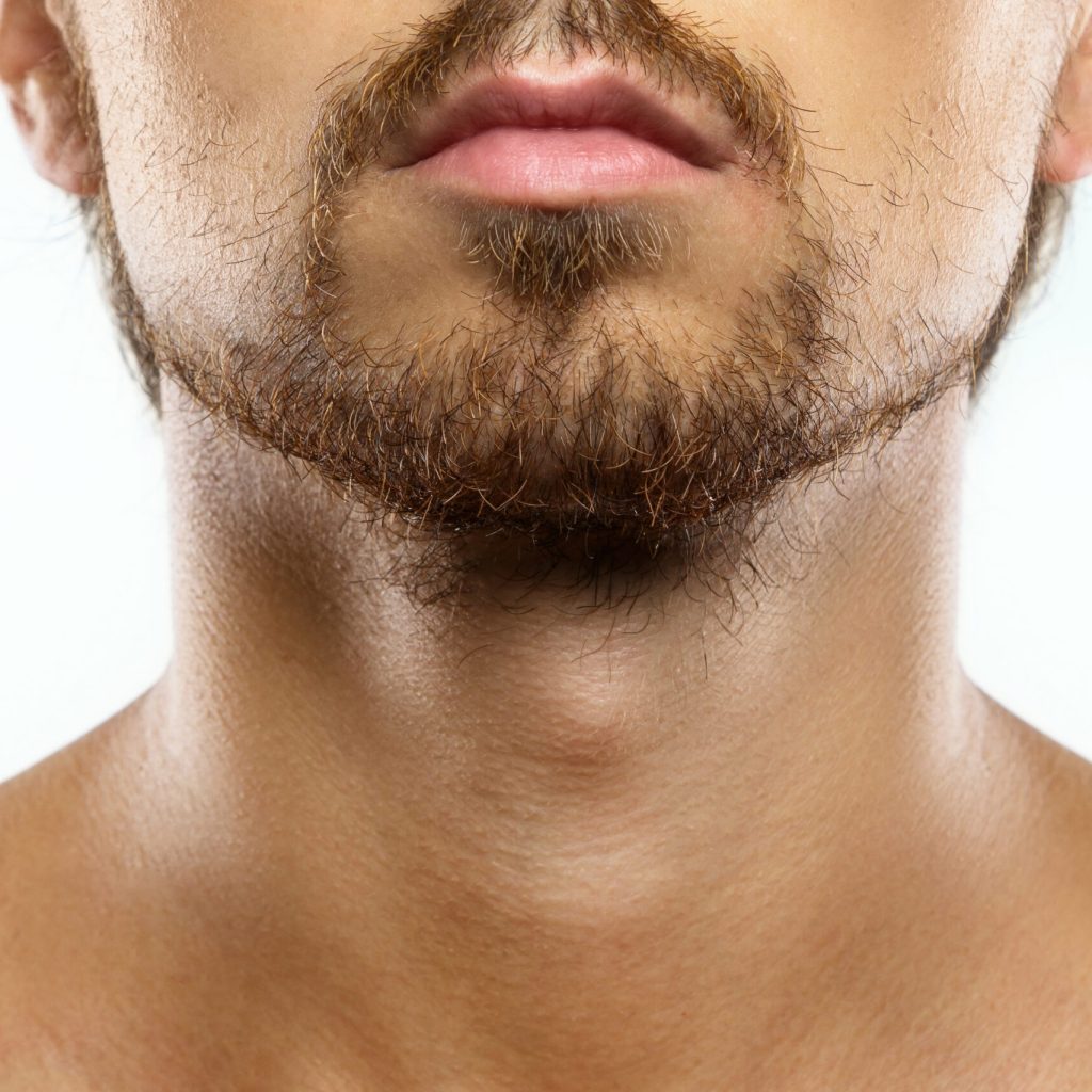 Closeup of unshaved men's face with a unkempt beard