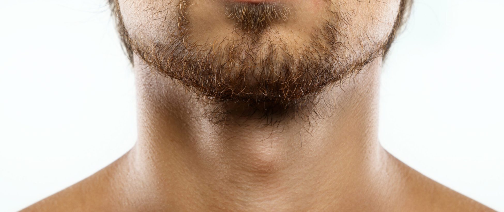 Closeup of unshaved men's face with a unkempt beard